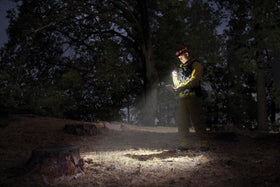 MagLite Mini Pro LED 2-Cell AA flashlight in holster for quick outdoor access.