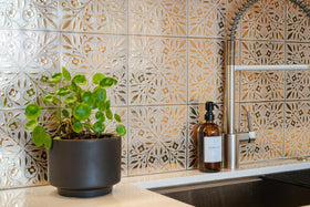 Main Street peel-and-stick tiles with blue leaves for an easy kitchen update