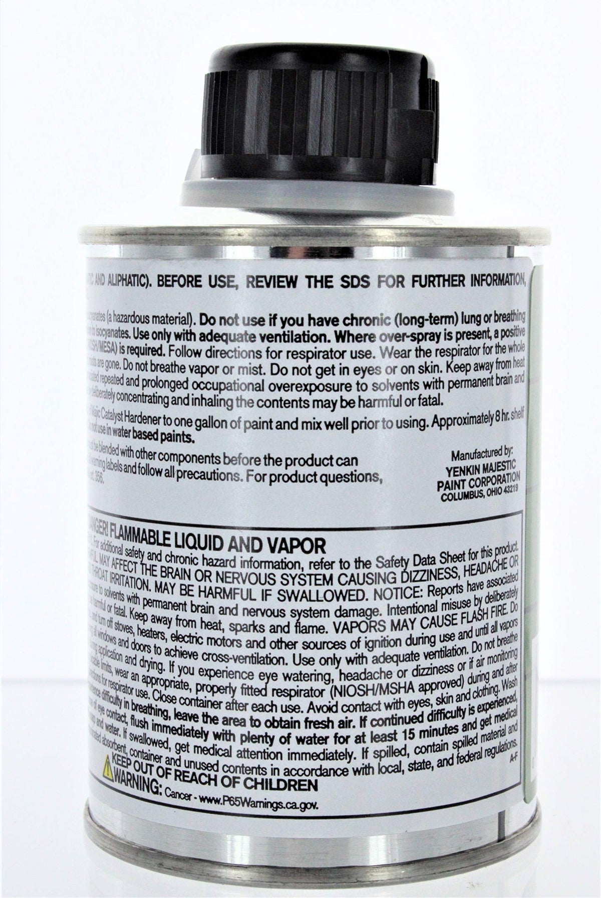 Majic hardener bottle on workspace; ideal for household painting projects and finishes.