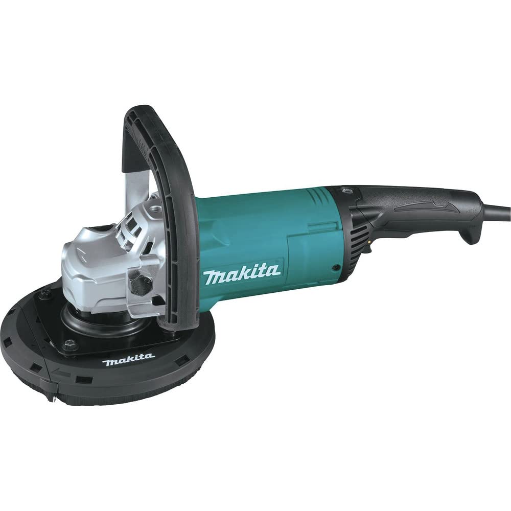 Makita GA9060RX3 with dust extraction shroud capturing concrete dust during planing
