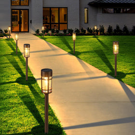 Mancra 8-pack solar pathway lights create welcoming driveways and borders after dusk.
