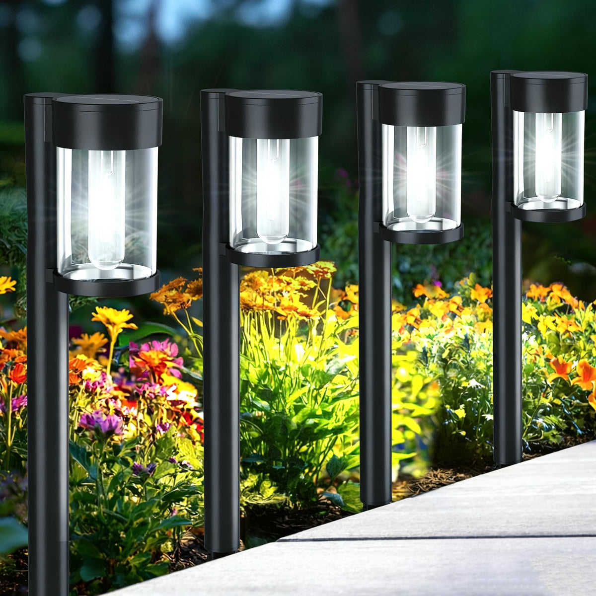 Mancra solar pathway lights with stakes ready for easy ground installation along pathways.
