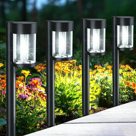 Mancra solar pathway lights with stakes ready for easy ground installation along pathways.