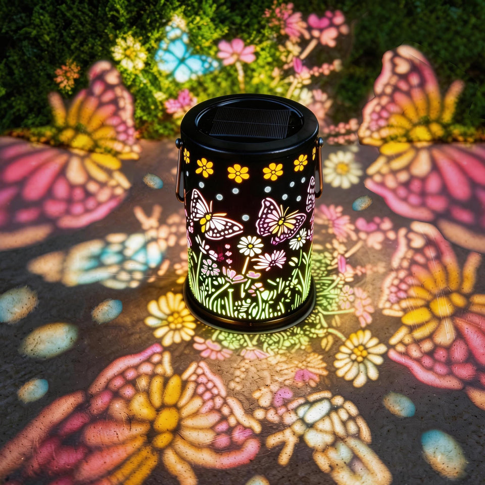Mantunt solar lantern with butterfly pattern lighting a garden path warmly.