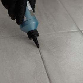MAPEI UltraCare Grout Refresh colorant being applied on biscuit grout for even results