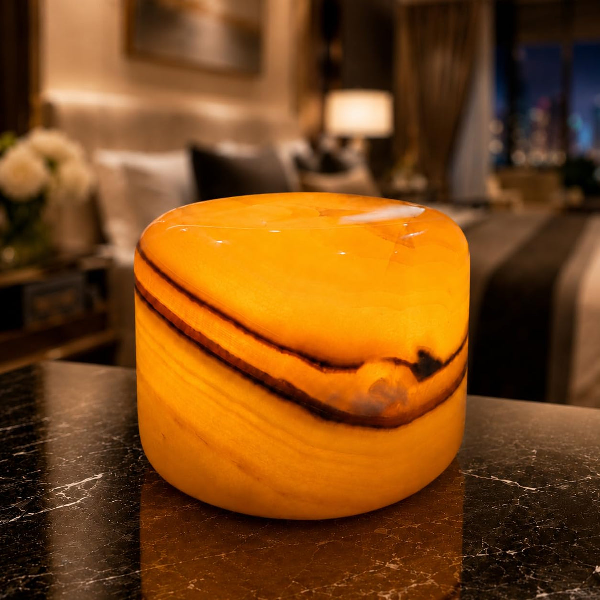 Marmor Marble Lamp night light in Calacatta Green adds warm ambience to bedrooms.