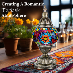 Marrakech Turkish lamp with bronze base highlights glass mosaic shade for decorative bedside lighting.