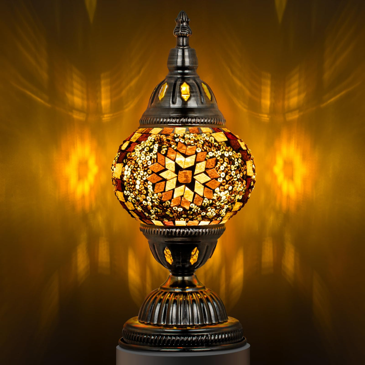 Marrakech Turkish table lamp with bronze base casts a warm glow in living rooms.