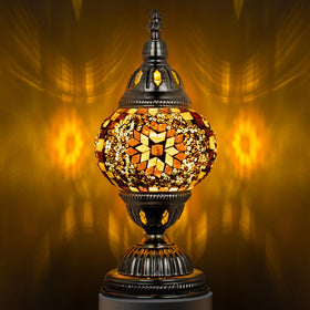 Marrakech Turkish table lamp with bronze base casts a warm glow in living rooms.