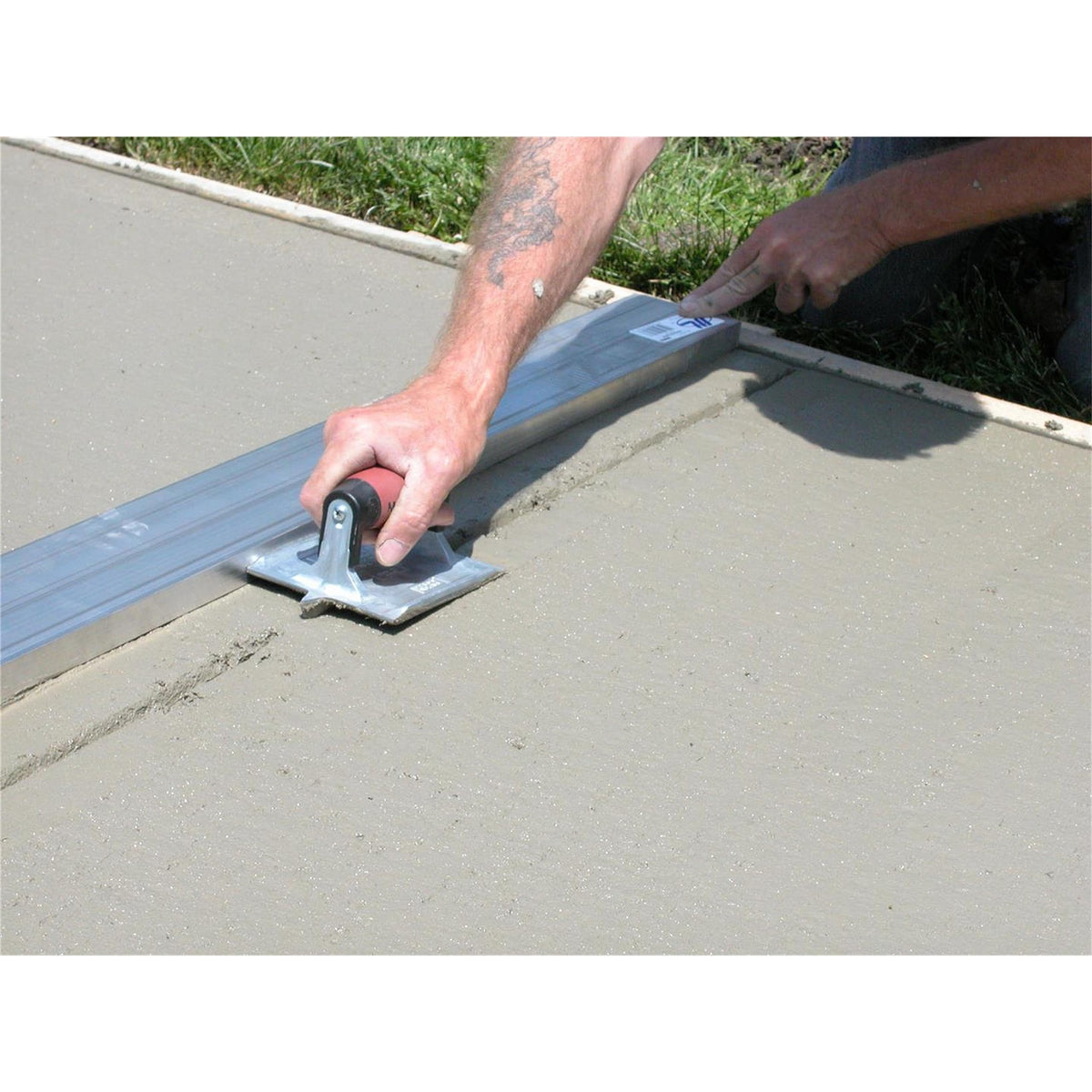 In-use shot showing precise grooves along a finished surface.