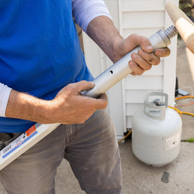 MARSHALLTOWN Threaded Handle Adapter in use with a broom for versatile applications.