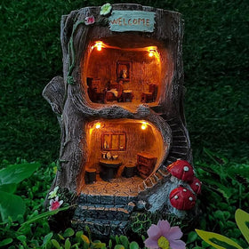 MARYTUMM solar light fairy tree house on base lights outdoor evenings with warm glow.