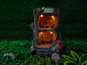 MARYTUMM tree root garden statue with LED lights for nighttime ambiance.