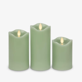 Matchless Candle Co. Luminara pastel-green candle features melted-edge detailing for added realism.