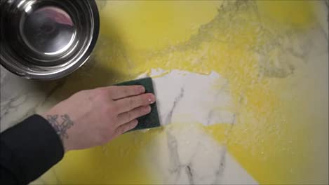 Max Strip easy-scrape removal action with a scraper tool in use.