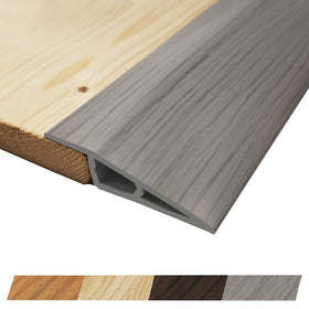 Maxiroc threshold ramp in gray oak ash creates smooth room transitions.