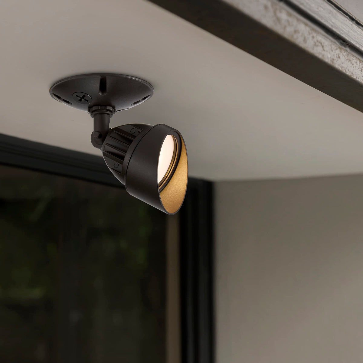 Maxxima flood light adjustable head concentrates light for precise outdoor illumination.