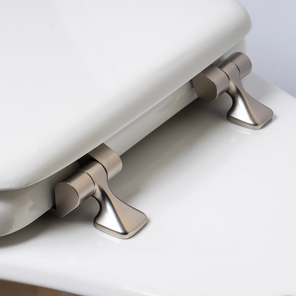Elongated white Mayfair seat fits most toilets for a clean look