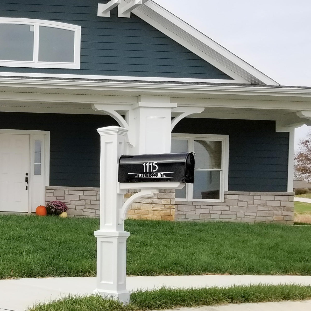 Mayne Newport Plus post installed in yard showing weather-ready design.