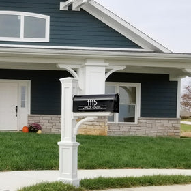 Mayne Newport Plus post installed in yard showing weather-ready design.