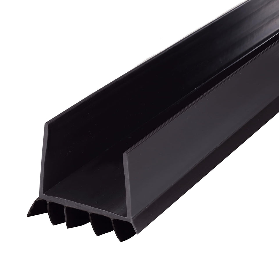 M-D Vinyl Cinch under-door seal installed on a door to block drafts.