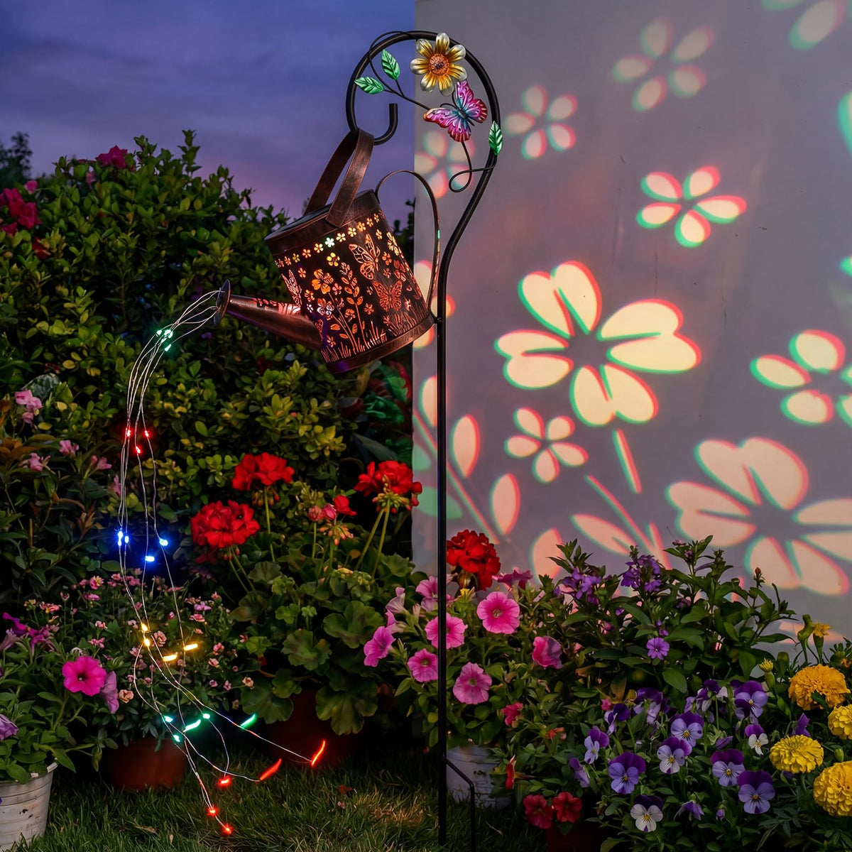 MEBRUDY solar butterfly watering can light illuminating garden paths at dusk