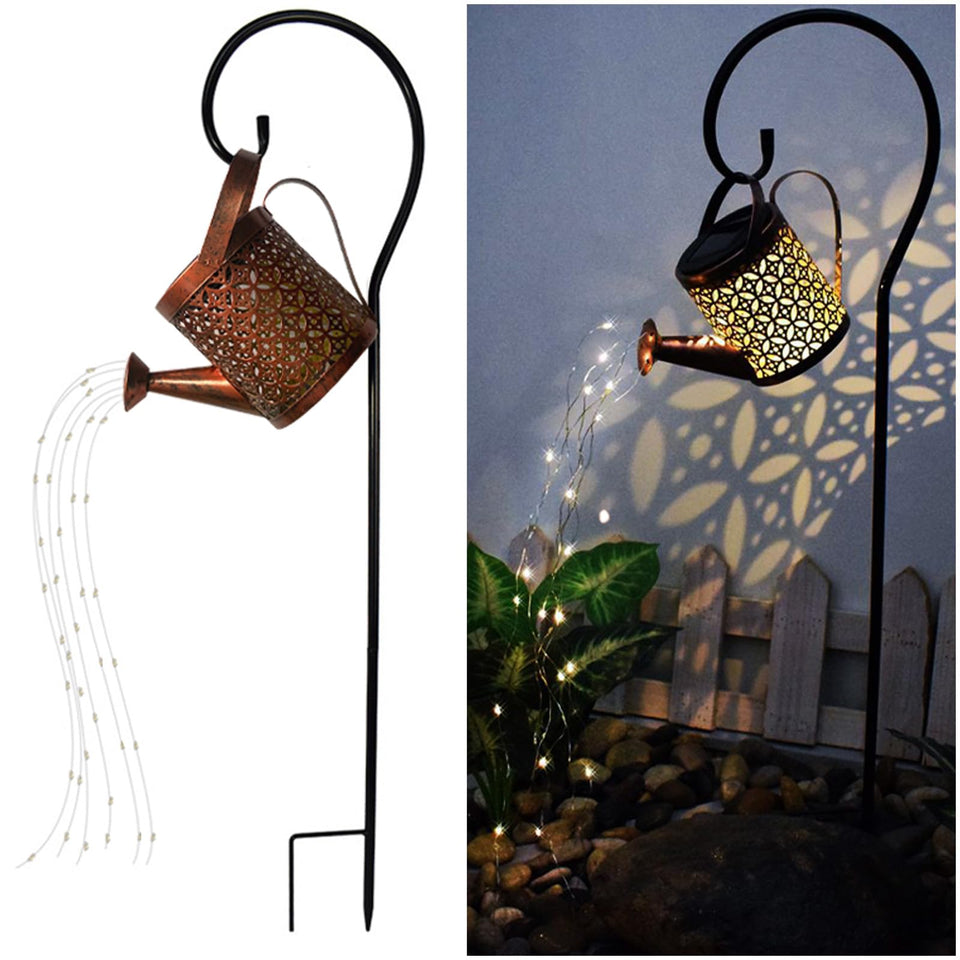 Merrytech solar watering can lantern lighting the garden with cascading water illusion.