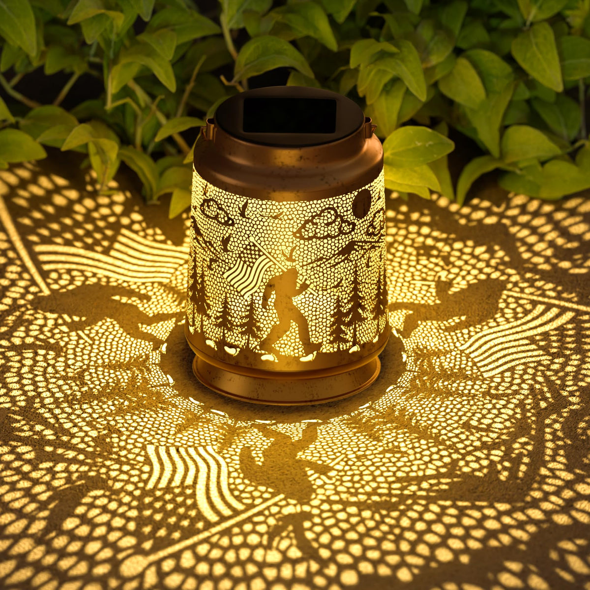 Miggley Bigfoot solar lantern glows beside a tree for atmospheric garden lighting.