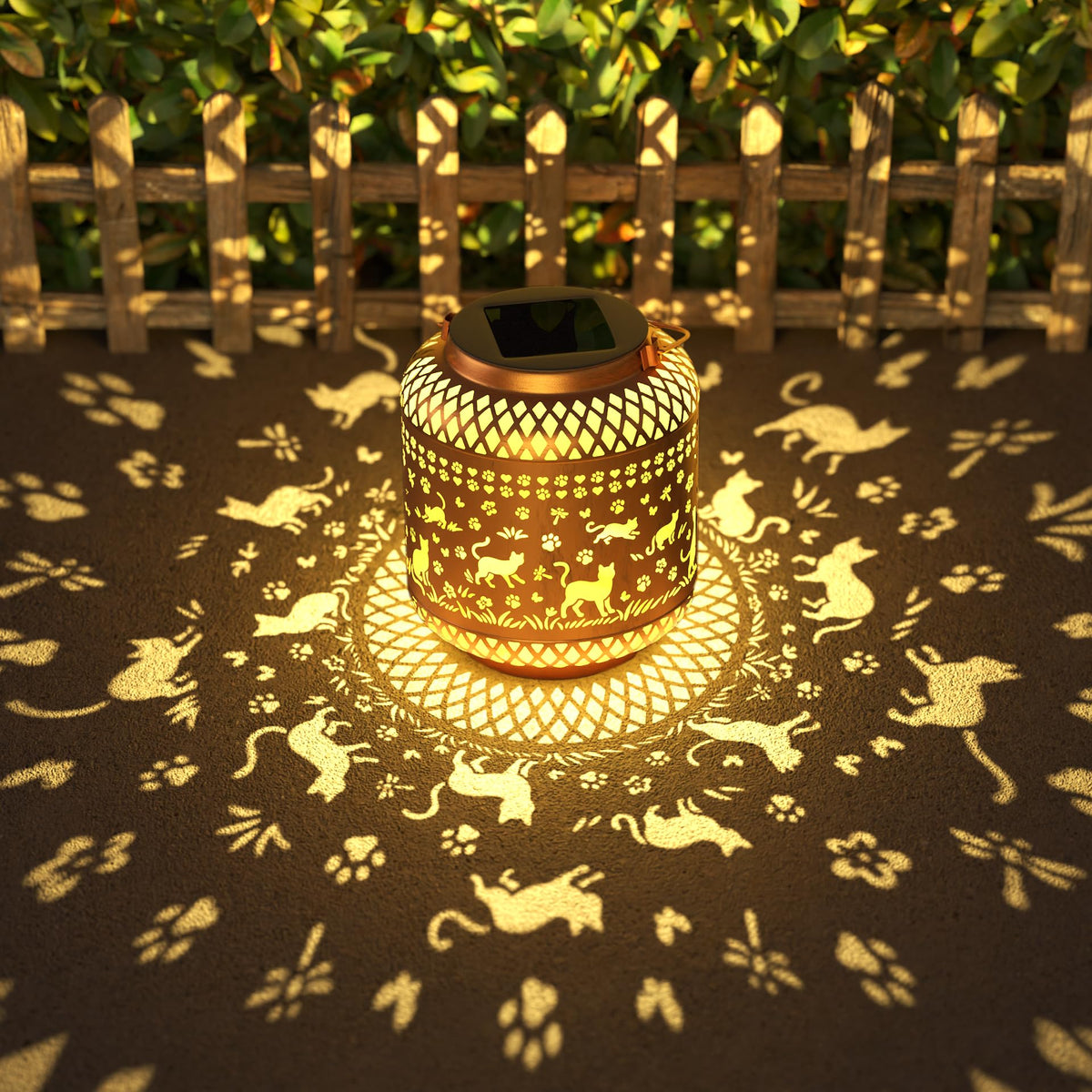 Miggley Cat Garden Solar Lantern hanging with warm glow over a patio.