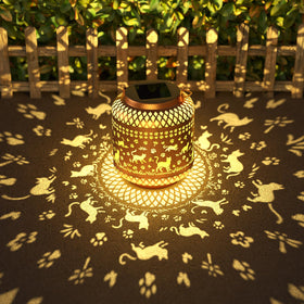 Miggley Cat Garden Solar Lantern hanging with warm glow over a patio.