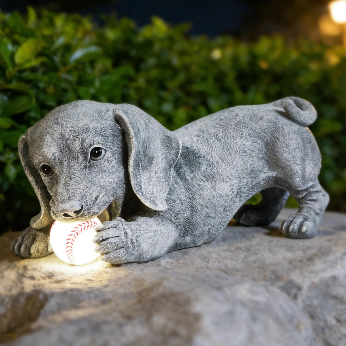 Miggley Dachshund solar garden statue glowing at dusk for outdoor charm.