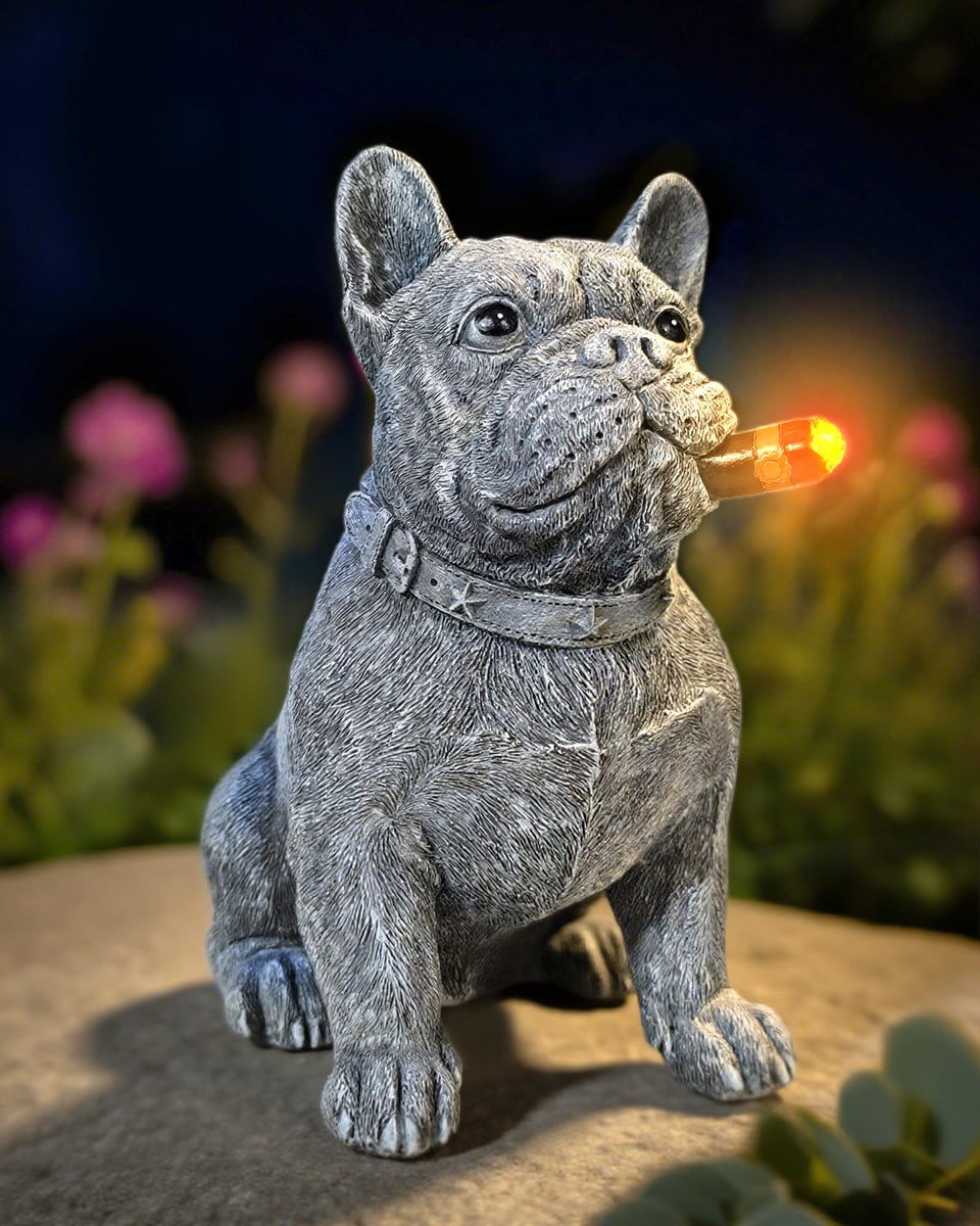 Miggley French Bulldog solar statue lights outdoor spaces at dusk.