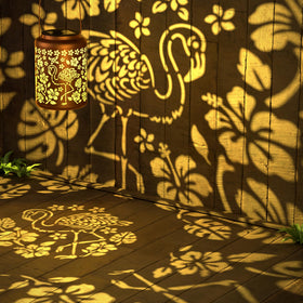 Miggley flamingo projection lantern demonstrates tropical charm for nighttime yard ambiance