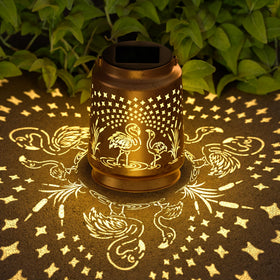 Miggley flamingo solar lantern hanging glow enhances patio ambiance at night.