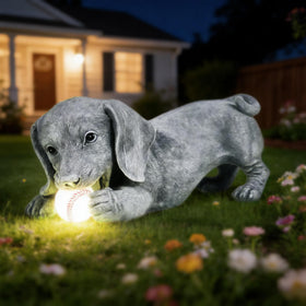Hand-painted details on Miggley dachshund statue enhance outdoor color.