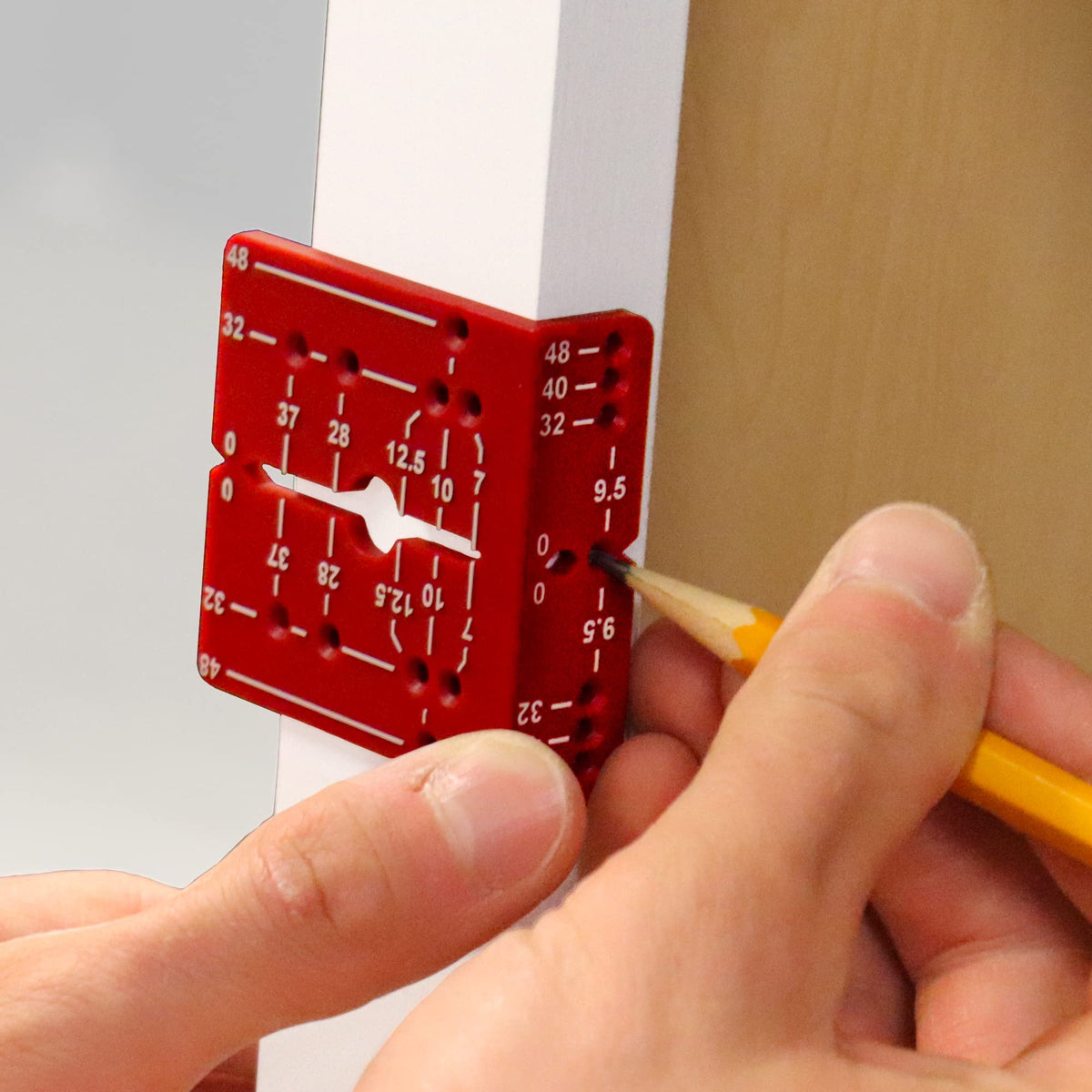 Milescraft EuroHingeJig edge alignment knobs demonstrate hole distance control