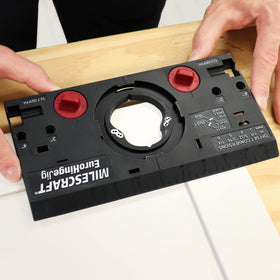Milescraft EuroHingeJig metal drill guide locks into place for accurate hinge holes