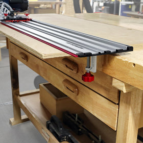 Milescraft red alignment strip guides blade to edge.