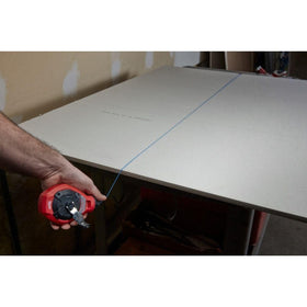Milwaukee chalk reel case opens for easy access to components.