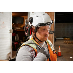 Milwaukee Bolt 24dB earmuffs set against a quiet work environment
