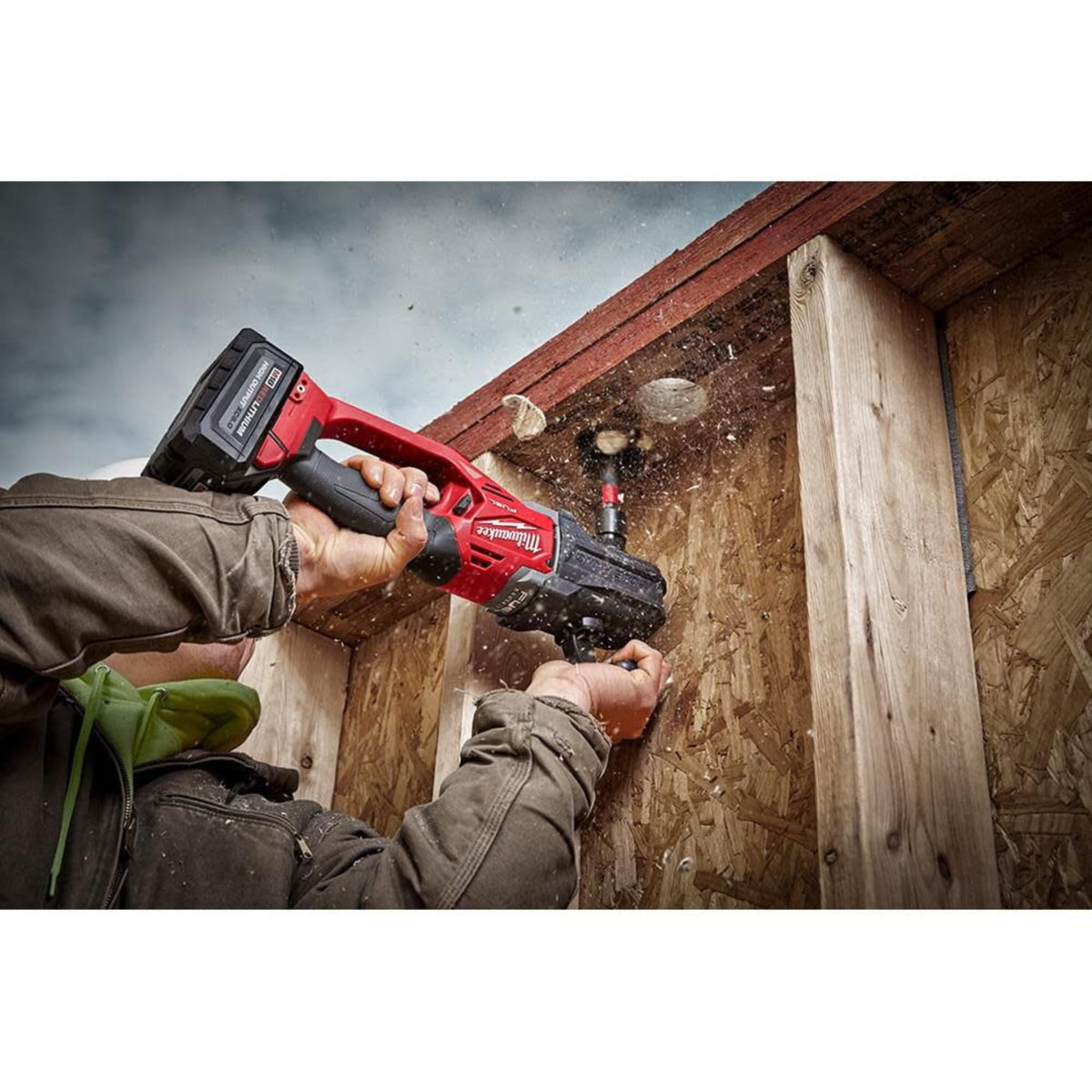 Milwaukee tool-only drill in use on a construction site, highlighting cordless power.