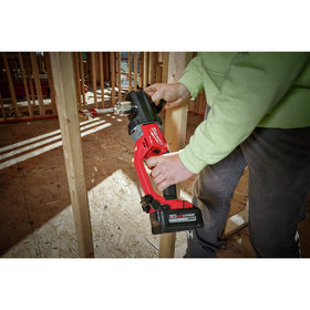 Milwaukee M18 FUEL Hole Hawg in-use demonstrates drilling large holes in wood framing.
