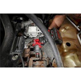 Milwaukee M18 FUEL tool in use under the hood during a repair.