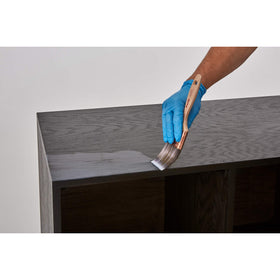 Minwax Polycrylic spray applying evenly on a wood surface for protection