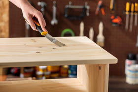 Minwax stainable wood filler layered to dry for deeper holes.
