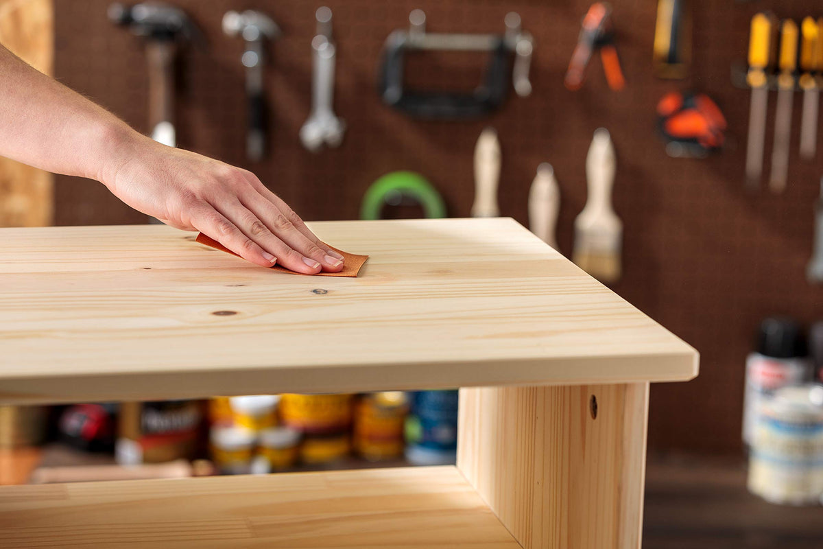 Minwax stainable wood filler sanding for a flush, smooth finish.