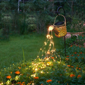 Misawce solar watering can lights with six strands brighten paths and create a dreamy garden ambience.