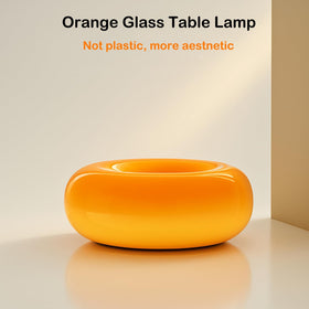 MIXL Orange Donut Lamp placed on nightstand for cozy reading light