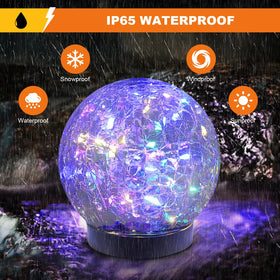 MLKNK crackled-glass-ball orb 4-pack adds warm garden ambiance at night.