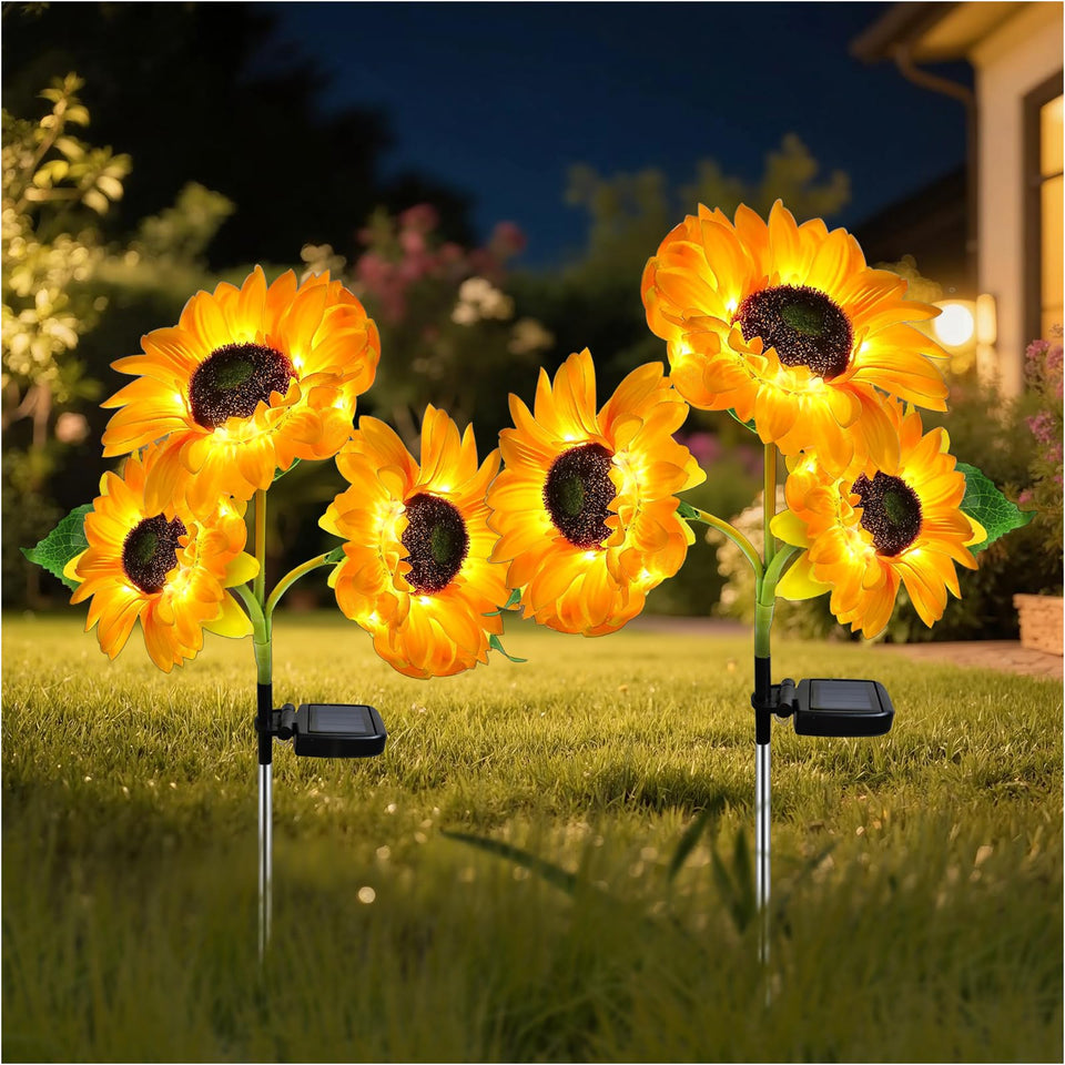 MMHF outdoor solar garden stake lights with three sunflowers illuminate pathways at night.